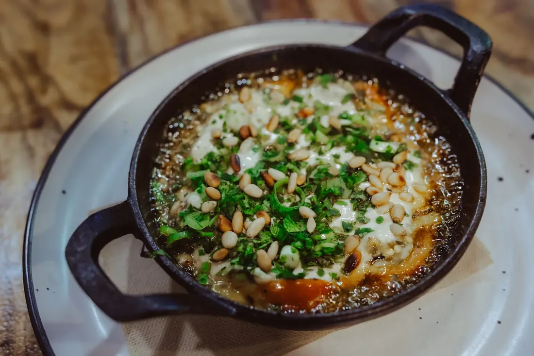 Lebanese Sinaia — warm smoky eggplant with cherry tomatoes, pine nuts, white tahini and paprika oil